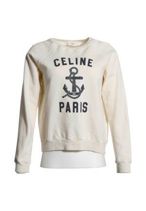 Kremowa bluza z długim rękawem z czarnym nadrukiem kotwicy i tekstem "CELINE PARIS" z przodu.