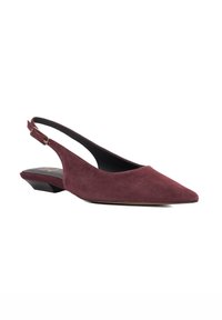Burgundy suede slingback shoe with a pointed toe, low heel, and adjustable strap, featuring a smooth texture and minimalist design.