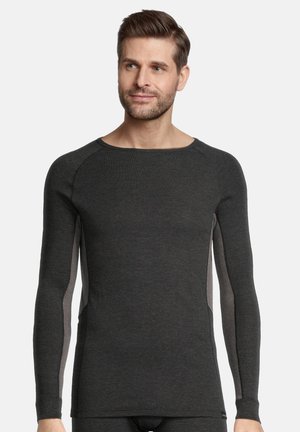 Grijze thermoshirt met lange mouwen en een geribde textuur, ronde hals en contrasterende lichtere zijpanelen. Strak model voor warmte.