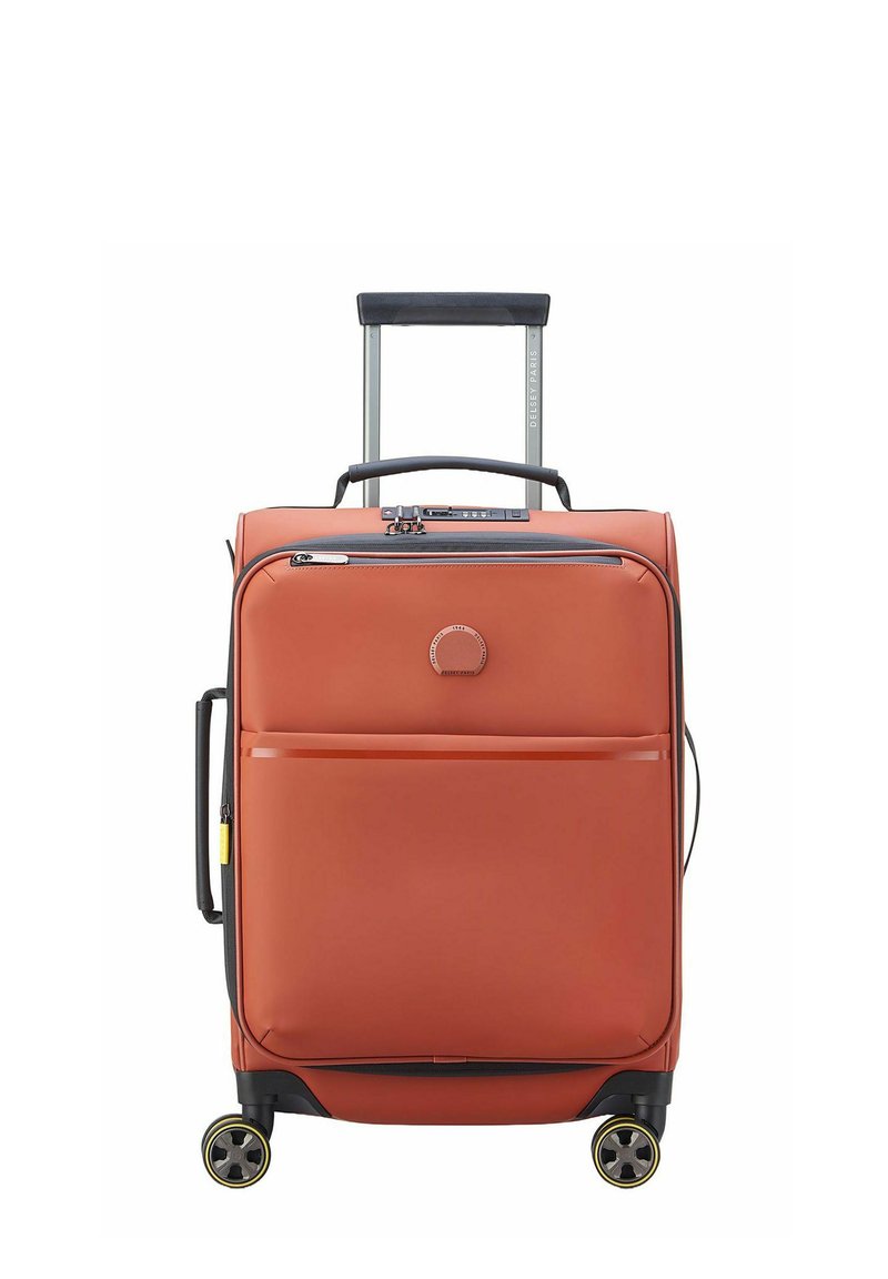 Valigia rigida arancione con maniglia estraibile, quattro ruote girevoli e tasca frontale con zip. Texture liscia e design minimalista.