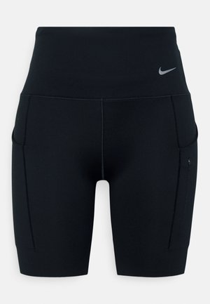 Mustad kõrge vöökohaga sportlikud lühikesed püksid, valmistatud venivast materjalist; külgedel on taskud ja vööl väike Nike logo.