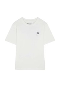 T-shirt bianco in cotone con maniche corte, caratterizzato da un piccolo logo di teschio e ossa incrociate in navy sulla parte sinistra del petto. Texture liscia.