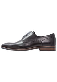 Black leather dress shoe with a smooth finish, pointed toe, blue shoelaces, and a stacked wooden heel. Subtle stitching detail on the sides.