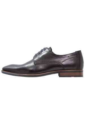 Black leather dress shoe with a smooth finish, pointed toe, blue shoelaces, and a stacked wooden heel. Subtle stitching detail on the sides.