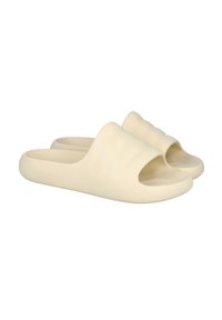 Sandalias beige tipo slip-on con los dedos al aire, de material de goma suave, que presentan tres surcos horizontales en la parte superior para mayor textura.