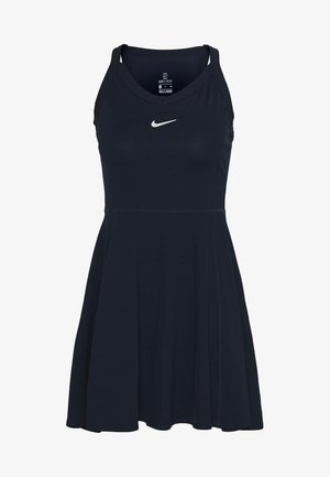 Robe sans manches bleu marine en tissu côtelé, avec un corsage ajusté, une jupe évasée et un petit logo Nike blanc sur la poitrine.