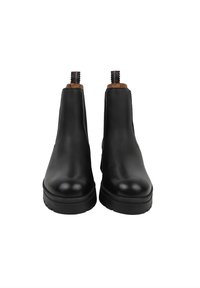 Stivali Chelsea in pelle nera con finitura liscia, punta tondeggiante, pannelli laterali elastici e linguette decorative sul tallone. Suola in gomma per una buona aderenza.