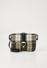 Plaid crossbody bag with a green, cream, and gold pattern. Features a black leather strap and flap, gold hardware ring detail.