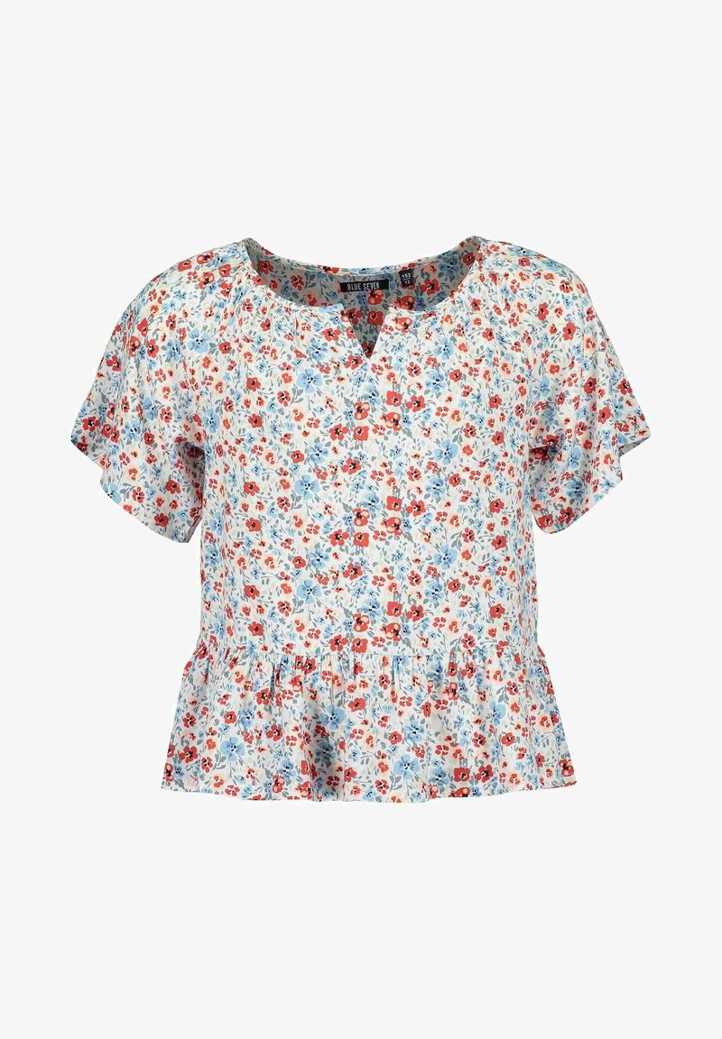 Blouse blanche à manches courtes avec imprimé floral rouge et bleu clair, encolure ronde avec petite découpe en V, et détail à ourlet volanté.