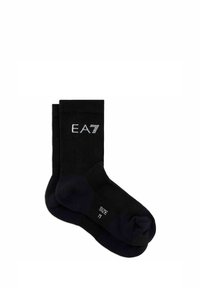 Calzini neri in cotone con texture a costine, caratterizzati dal logo EA7 bianco sul risvolto. Taglia M indicata sulla suola. Design semplice e funzionale.