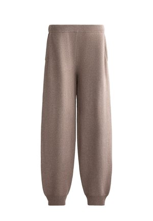 Pantaloni della tuta larghi marroni con vita a coste e due tasche laterali, realizzati in un morbido tessuto testurizzato.
