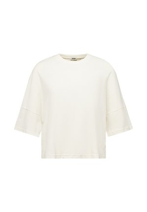 Jednobarevné bílé oversized tričko s krátkými rukávy, kulatým výstřihem a spadlými švy na ramenou.