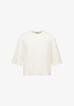 Camiseta blanca lisa de manga corta sobredimensionada con cuello redondo y costuras de hombro caídas.