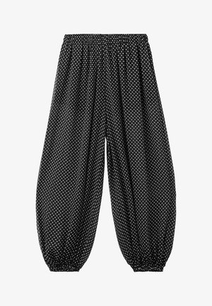 Pantalon ample noir à pois blancs, avec taille élastique et poignets élastiques froncés aux chevilles.