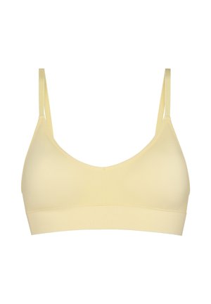 Reggiseno wireless beige morbido con spalline sottili regolabili e una fascia ampia sotto il busto, progettato per comfort e supporto leggero.