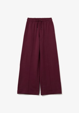 Burgunderfarbene weit geschnittene Hose aus weichem Stoff, mit einem elastischen Bund und Kordelzug sowie zwei vorderen Falten für zusätzlichen Detailreichtum.