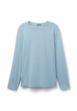 T-shirt manches longues bleu clair en coton doux. Encolure ronde, coupe décontractée et ourlet droit avec fentes latérales pour faciliter les mouvements.