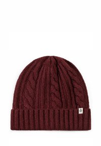 Maroon knitted beanie with textured cable knit pattern and ribbed hem. Features a small logo tag on the side. Soft acrylic material.