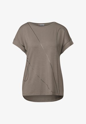 Camiseta de manga corta gris, hecha de una tela suave, con líneas abstractas en negro y plata. Corte relajado con un dobladillo redondeado.