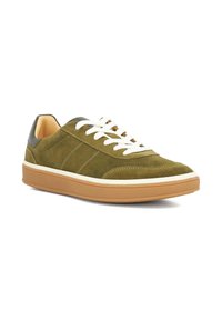Green suede sneakers with white laces, cream midsole, and brown rubber outsole. Features a leather heel accent and side stitching details.