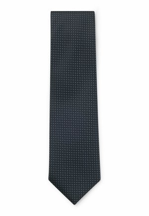 Cravate navy avec un motif texturé de petits points blancs, pointe effilée et finition lisse. Fabriquée en tissu tissé avec un design classique.