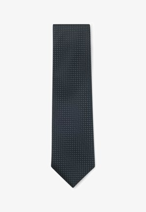 Navy tie with a textured pattern of small white dots, pointed tip, and a smooth finish. Made from woven fabric with a classic design.