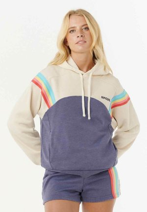 Sudadera con capucha en color crema y azul marino, con detalles de rayas de colores en los hombros y un bolsillo delantero. Tejido suave y casual.