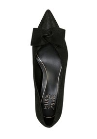 Chaussures plates noires à bout pointu avec un dessus texturé et un nœud décoratif sur le devant. L'intérieur présente une doublure noire lisse et contrastée.