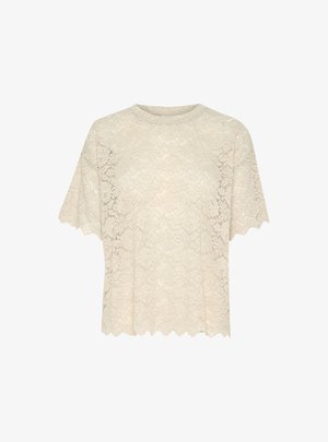Lace top in cream, featuring a round neckline, short flutter sleeves, and scalloped hem with a floral pattern throughout.