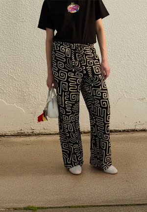 Rip Curl SUNSET LUAU WIDE LEG PANTS - Pantalon classique - black/off white