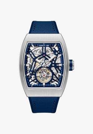 Orologio da polso con cinturino in pelle blu, cassa rettangolare in argento e movimento meccanico scheletrato visibile sul quadrante.