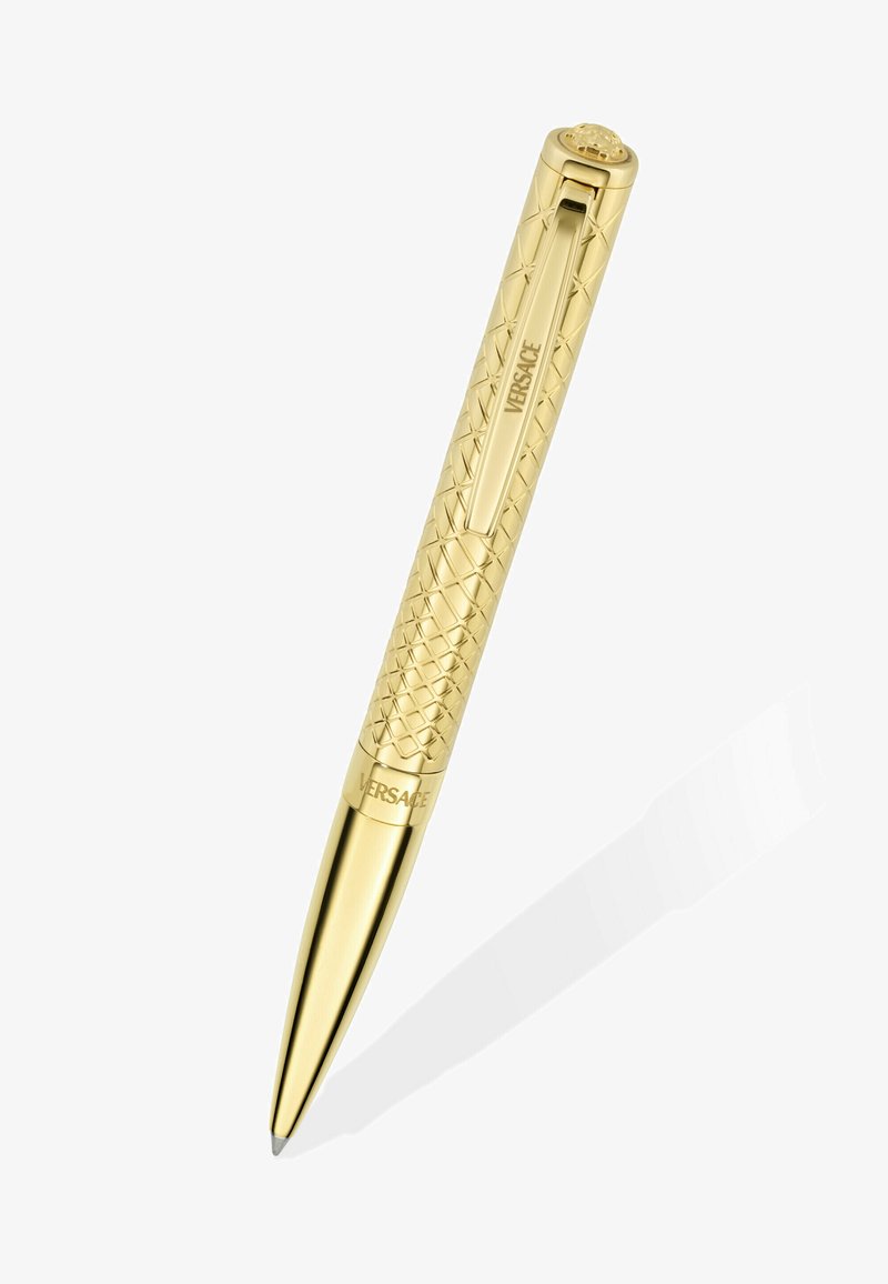 Zlatna kemijska olovka s prošivenim uzorkom, kopčom urezanom s natpisom "VERSACE" i grbom Meduse na vrhu.