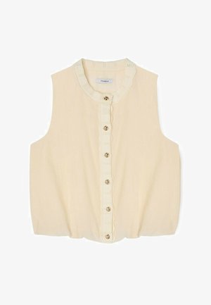 Blusa sin mangas de color crema con borde de encaje festoneado a lo largo de la tapeta de botones y el escote, con seis botones dorados en el frente.