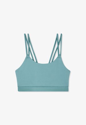 Niebieski stanik sportowy o gładkiej fakturze, z cienkimi, skrzyżowanymi ramiączkami i szerokim pasem na dole. Brak widocznych wkładek lub fiszbin.