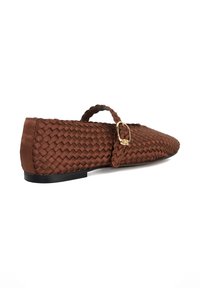 Brown woven leather shoe with rounded toe, small heel, and decorative buckle. Smooth texture with intricate braided design.