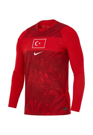 Czerwona sportowa koszulka z długim rękawem z flagą Turcji i białym logo Nike na piersi, z wirującym teksturowanym wzorem na materiale.