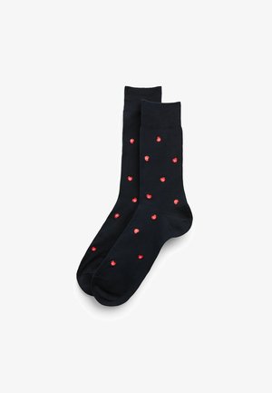 Dark blue socks featuring a pattern of small red hearts across the surface. Made from soft, stretchy fabric with a ribbed cuff.
