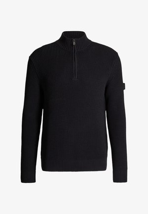 Pull-over en maille noire avec col montant à fermeture éclair sur un quart et manches longues, doté d'un ourlet et de poignets côtelés.