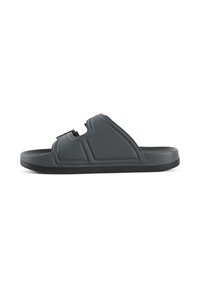 Donkergrijze slip-on sandaal van zacht plastic. Voorzien van een enkele verstelbare band en een getextureerde zool voor grip. Gecenterde vorm met padding.