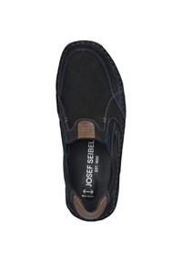 Black suede slip-on shoe with a brown leather accent. Features perforated insole, stitched detailing, and a rounded toe design.