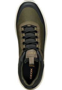 Black and olive green sneaker with a textured upper, cushioned sole, and lace-up design. Features logo on tongue and toe cap.
