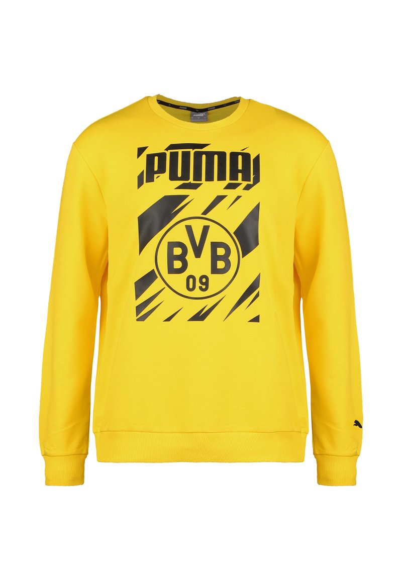 Żółta bluza z bawełny z czarnymi grafikami. Posiada okrągły dekolt, długie rękawy oraz ściągacze na rękawach i u dołu. Obecne logo i szczegóły drużyny.