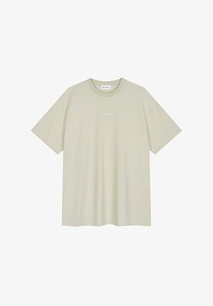 Svetlo béžové tričko vyrobené z mäkké bavlny, s krátkymi rukávmi, okrúhlym výstrihom a malým bielym textom "OH APRIL" na hrudi.