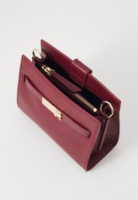 Tommy Hilfiger HERITAGE MINI SATCHEL - Käsilaukku - raspberry truffle