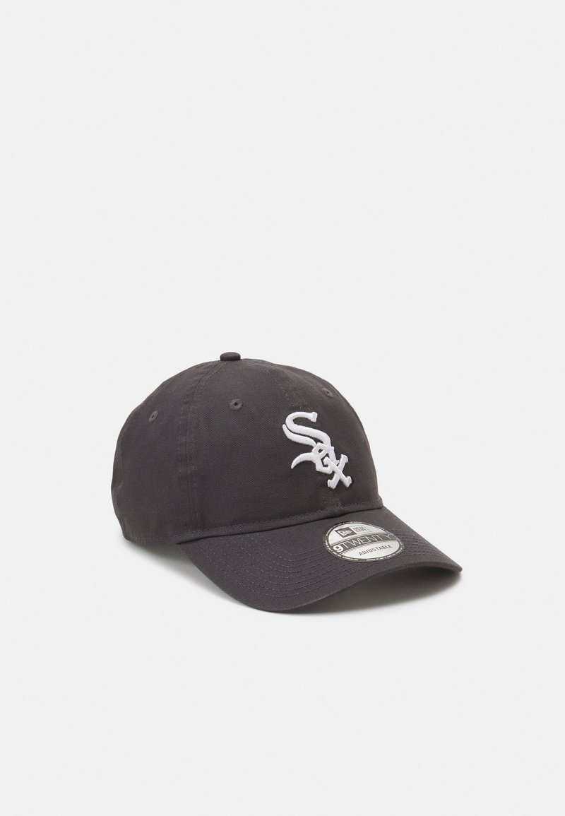 Black baseball cap made of sturdy fabric featuring a raised white embroidered "Sox" logo on the front. Curved visor and adjustable back strap.