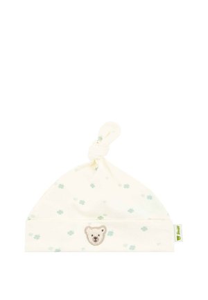 White baby hat in soft cotton with a knotted top, featuring light green flower patterns and a bear face embroidery on the front.