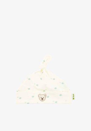 White baby hat in soft cotton with a knotted top, featuring light green flower patterns and a bear face embroidery on the front.