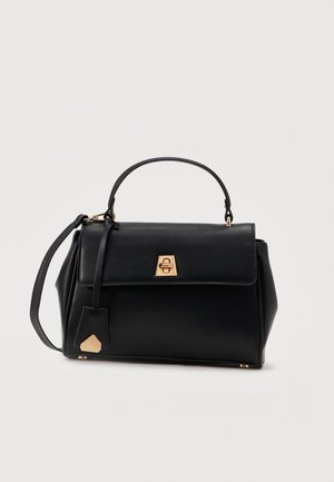 Black leather handbag with top handle, flap closure featuring gold-tone clasp, and detachable shoulder strap against white background.