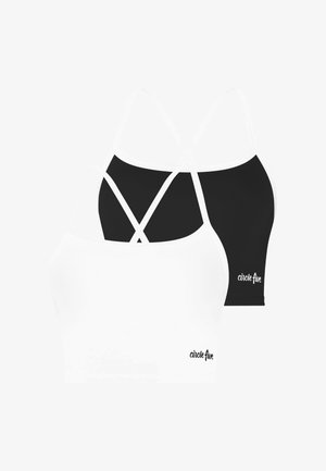 Zwei Sport-BHs, einer weiß und einer schwarz, mit dünnen gekreuzten Trägern und "circle five" Logo nahe dem unteren Saum.
