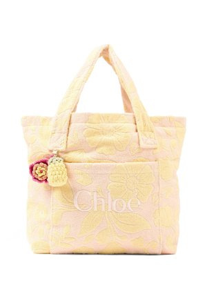 Borsa a tracolla con motivo floreale giallo su sfondo chiaro, manici imbottiti, tasca frontale, logo "Chloé" e due piccoli ciondoli a forma di fiore all'uncinetto.